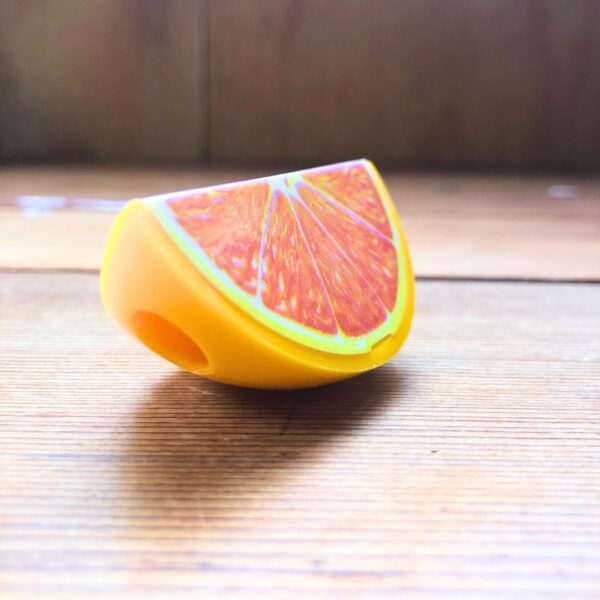 orange wedge/slice shaped pencil sharpener that opens