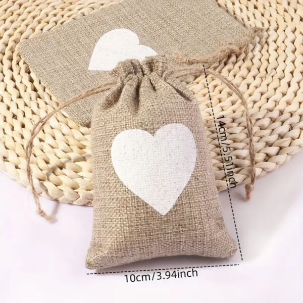 burlap gift bag with white heart on it